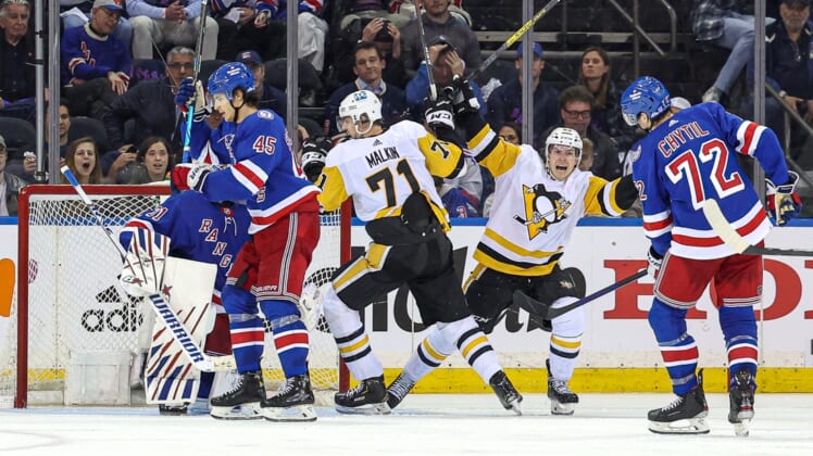 May 3, 2022; New York, New York, USA; Pittsburgh Penguins center Evgeni Malkin (71) reacts with left wing Brock McGinn (23) after scoring a goal past New York Rangers goaltender Igor Shesterkin (31) during the third overtime in game one of the first round of the 2022 Stanley Cup Playoffs at Madison Square Garden. Mandatory Credit: Vincent Carchietta-USA TODAY Sports