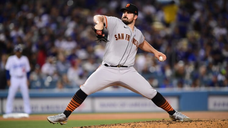 May 3, 2022; Los Angeles, California, USA; San Francisco Giants starting pitcher Carlos Rodon (16) throws against the Los Angeles Dodgers during the fourth inning at Dodger Stadium. Mandatory Credit: Gary A. Vasquez-USA TODAY Sports
