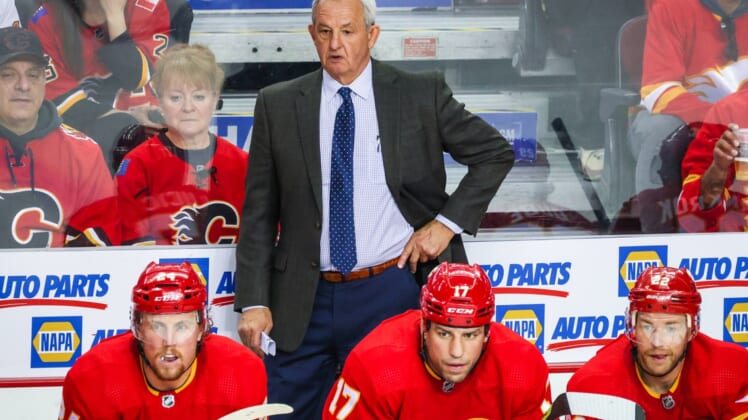 May 3, 2022; Calgary, Alberta, CAN; Calgary Flames head coach Darryl Sutter on his bench against the Dallas Stars during the second period in game one of the first round of the 2022 Stanley Cup Playoffs at Scotiabank Saddledome. Mandatory Credit: Sergei Belski-USA TODAY Sports