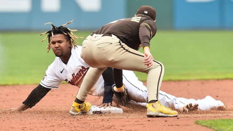May 4, 2022; Cleveland, Ohio, USA; Cleveland Guardians third baseman Jose Ramirez (11) steals second as San Diego Padres second baseman Jake Cronenworth (9) is late with the tag during the first inning at Progressive Field. Mandatory Credit: Ken Blaze-USA TODAY Sports