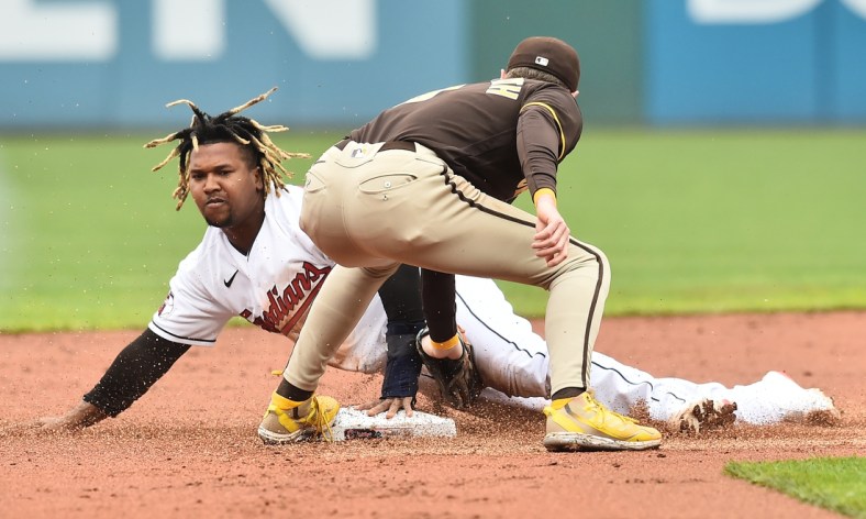 May 4, 2022; Cleveland, Ohio, USA; Cleveland Guardians third baseman Jose Ramirez (11) steals second as San Diego Padres second baseman Jake Cronenworth (9) is late with the tag during the first inning at Progressive Field. Mandatory Credit: Ken Blaze-USA TODAY Sports