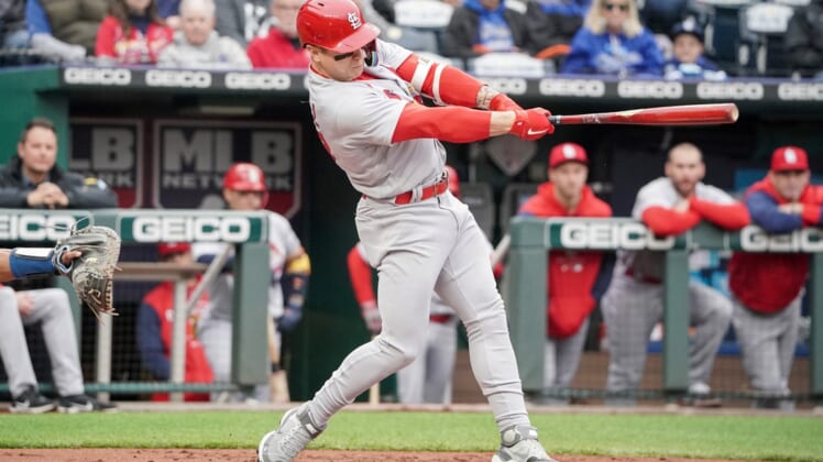 May 4, 2022; Kansas City, Missouri, USA; St. Louis Cardinals left fielder Tyler O'Neill (27) hits a triple against the Kansas City Royals in the first inning at Kauffman Stadium. Mandatory Credit: Denny Medley-USA TODAY Sports
