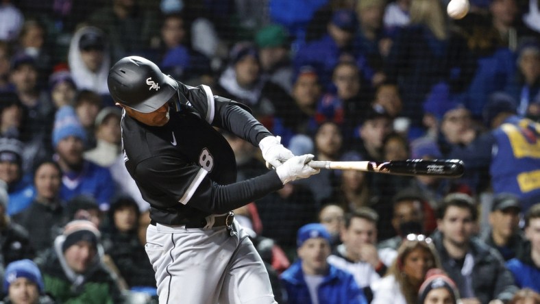 May 4, 2022; Chicago, Illinois, USA; Chicago White Sox left fielder AJ Pollock (18) hits an RBI-single against the Chicago Cubs during the sixth inning at Wrigley Field. Mandatory Credit: Kamil Krzaczynski-USA TODAY Sports