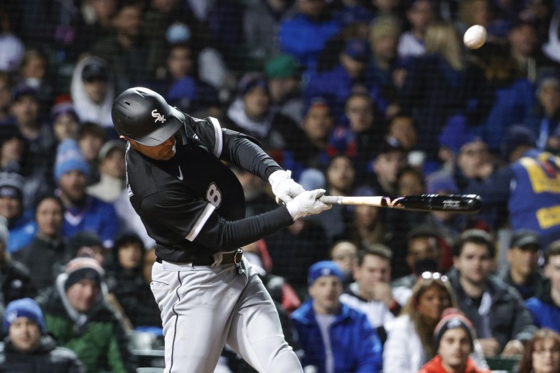 May 4, 2022; Chicago, Illinois, USA; Chicago White Sox left fielder AJ Pollock (18) hits an RBI-single against the Chicago Cubs during the sixth inning at Wrigley Field. Mandatory Credit: Kamil Krzaczynski-USA TODAY Sports