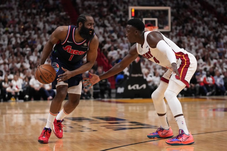 May 4, 2022; Miami, Florida, USA; Philadelphia 76ers guard James Harden (1) controls the ball around Miami Heat guard Victor Oladipo (4) during second half in game two of the second round for the 2022 NBA playoffs at FTX Arena. Mandatory Credit: Jasen Vinlove-USA TODAY Sports