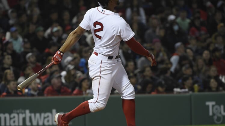 May 4, 2022; Boston, Massachusetts, USA; Boston Red Sox shortstop Xander Bogaerts (2) hits a home run during the eighth inning against the Los Angeles Angels at Fenway Park. Mandatory Credit: Bob DeChiara-USA TODAY Sports