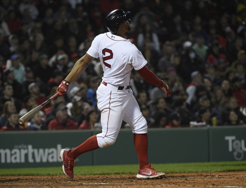 May 4, 2022; Boston, Massachusetts, USA; Boston Red Sox shortstop Xander Bogaerts (2) hits a home run during the eighth inning against the Los Angeles Angels at Fenway Park. Mandatory Credit: Bob DeChiara-USA TODAY Sports