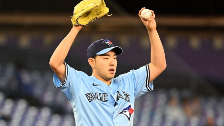 May 4, 2022; Toronto, Ontario, CAN;  Toronto Blue Jays starting pitcher Yusei Kikuchi (16) stretches between batters in the fourth inning against the New York Yankees at Rogers Centre. Mandatory Credit: Dan Hamilton-USA TODAY Sports