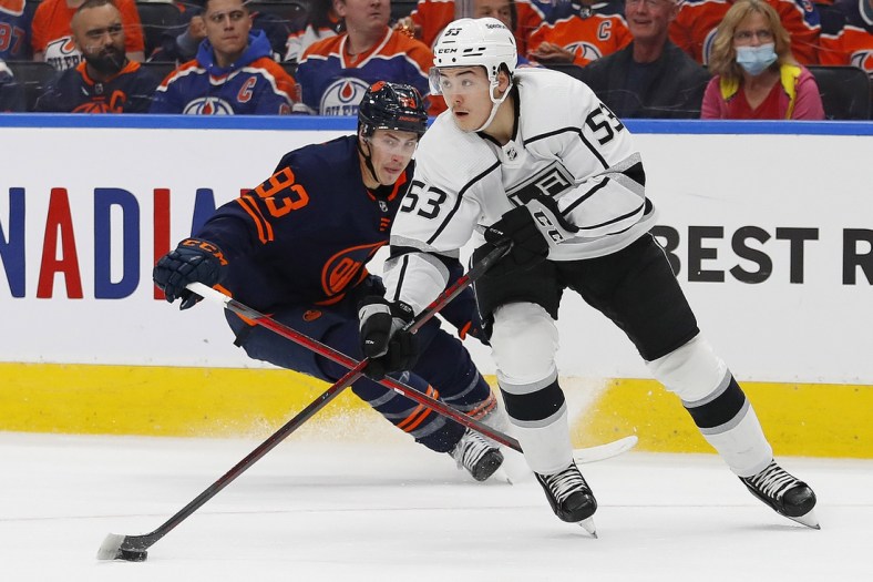 May 4, 2022; Edmonton, Alberta, CAN; Los Angeles Kings defensemen Jordan Spence (53) looks to make a pass in front of Edmonton Oilers forward Ryan Nugent-Hopkins (93) during the first period in game two of the first round of the 2022 Stanley Cup Playoffs at Rogers Place. Mandatory Credit: Perry Nelson-USA TODAY Sports