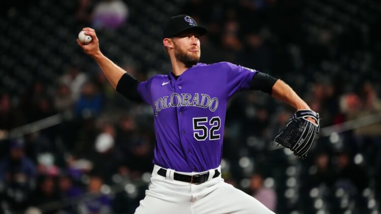 May 4, 2022; Denver, Colorado, USA; Colorado Rockies relief pitcher Daniel Bard (52) delivers a pitch in the ninth inning against the Washington Nationals at Coors Field. Mandatory Credit: Ron Chenoy-USA TODAY Sports