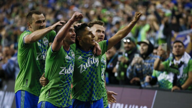 May 4, 2022; Seattle, WA, USA; Seattle Sounders FC forward Ra  l Ruid  az (9, second from right) celebrates with forward Jordan Morris (13, left), midfielder Nicol  s Lodeiro (10) and midfielder Albert Rusn  k (11, right) after scoring a goal against Pumas during the second half of the second leg of the Concacaf Champions League Final at Lumen Field. Mandatory Credit: Joe Nicholson-USA TODAY Sports