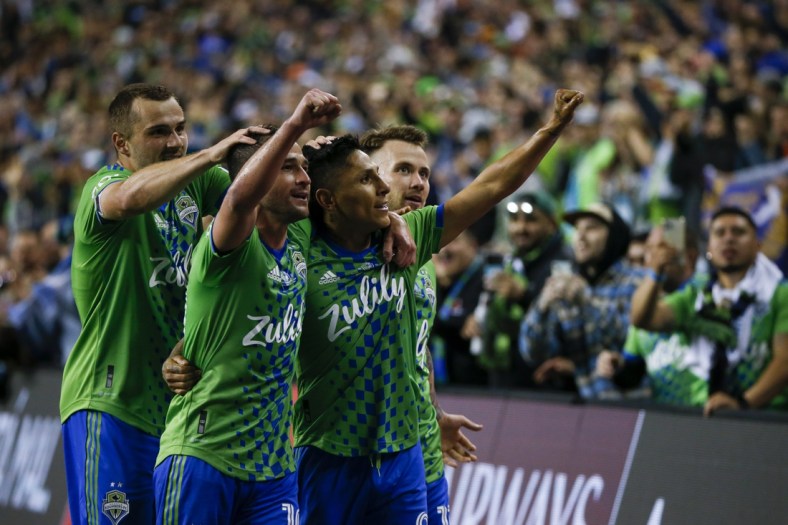 May 4, 2022; Seattle, WA, USA; Seattle Sounders FC forward Ra  l Ruid  az (9, second from right) celebrates with forward Jordan Morris (13, left), midfielder Nicol  s Lodeiro (10) and midfielder Albert Rusn  k (11, right) after scoring a goal against Pumas during the second half of the second leg of the Concacaf Champions League Final at Lumen Field. Mandatory Credit: Joe Nicholson-USA TODAY Sports