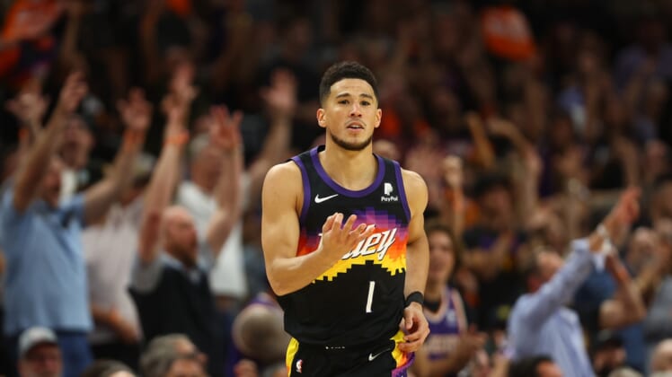 May 4, 2022; Phoenix, Arizona, USA; Phoenix Suns guard Devin Booker (1) reacts after scoring a basket against the Dallas Mavericks during the second half in game two of the second round for the 2022 NBA playoffs at Footprint Center. Mandatory Credit: Mark J. Rebilas-USA TODAY Sports