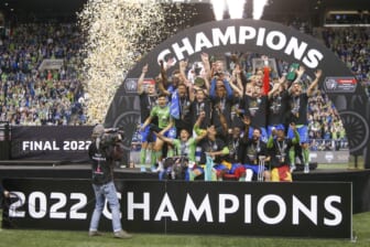 May 4, 2022; Seattle, WA, USA; Seattle Sounders FC players, including midfielder Nicolas Lodeiro (10, holding trophy) celebrate after defeating Pumas 3-0 in the second leg of the Concacaf Champions League Final at Lumen Field. Mandatory Credit: Joe Nicholson-USA TODAY Sports
