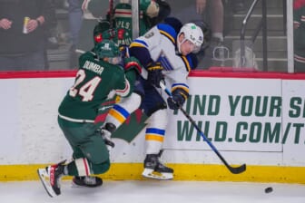 May 4, 2022; Saint Paul, Minnesota, USA; Minnesota Wild defenseman Matt Dumba (24) checks St. Louis Blues center Ivan Barbashev (49) in the third period in game two of the first round of the 2022 Stanley Cup Playoffs at Xcel Energy Center. Mandatory Credit: Brad Rempel-USA TODAY Sports
