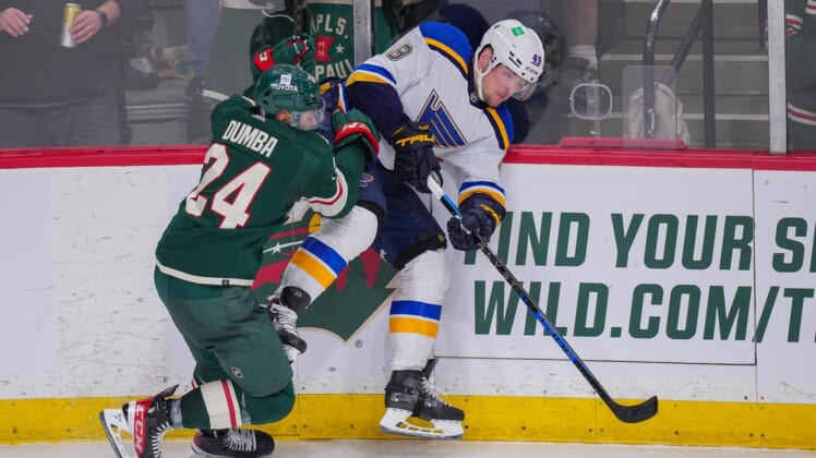 May 4, 2022; Saint Paul, Minnesota, USA; Minnesota Wild defenseman Matt Dumba (24) checks St. Louis Blues center Ivan Barbashev (49) in the third period in game two of the first round of the 2022 Stanley Cup Playoffs at Xcel Energy Center. Mandatory Credit: Brad Rempel-USA TODAY Sports
