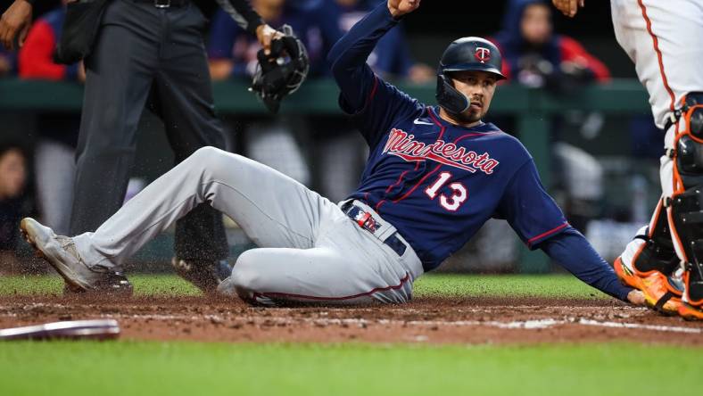 May 5, 2022; Baltimore, Maryland, USA; Minnesota Twins left fielder Trevor Larnach (13) scores a run against the Baltimore Orioles during the third inning at Oriole Park at Camden Yards. Mandatory Credit: Scott Taetsch-USA TODAY Sports