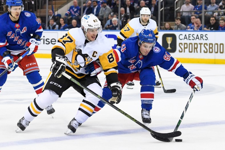 May 5, 2022; New York, New York, USA; Pittsburgh Penguins center Sidney Crosby (87) battle with New York Rangers defenseman Justin Braun (61) during the second period in game two of the first round of the 2022 Stanley Cup Playoffs at Madison Square Garden. Mandatory Credit: Dennis Schneidler-USA TODAY Sports