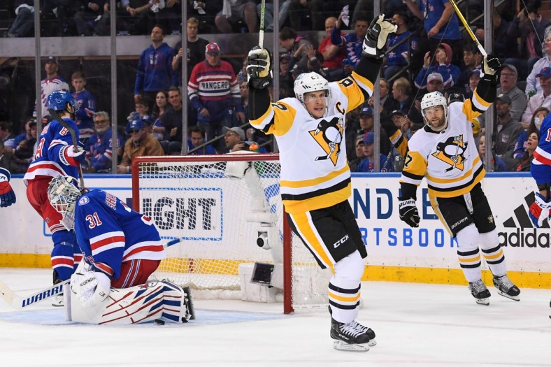 May 5, 2022; New York, New York, USA; Pittsburgh Penguins center Sidney Crosby (87) scores a goal on New York Rangers goaltender Igor Shesterkin (31) during the second period in game two of the first round of the 2022 Stanley Cup Playoffs at Madison Square Garden. Mandatory Credit: Dennis Schneidler-USA TODAY Sports