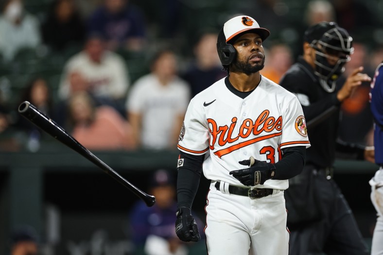 May 5, 2022; Baltimore, Maryland, USA; Baltimore Orioles center fielder Cedric Mullins (31) tosses his bat after being hit by a pitch against the Minnesota Twins during the seventh inning at Oriole Park at Camden Yards. Mandatory Credit: Scott Taetsch-USA TODAY Sports