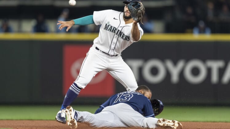 May 5, 2022; Seattle, Washington, USA; Tampa Bay Rays rightfielder Manuel Margot (13) steals second base before Seattle Mariners second baseman can field a throw from home plate during the fourth inning at T-Mobile Park. Mandatory Credit: Stephen Brashear-USA TODAY Sports