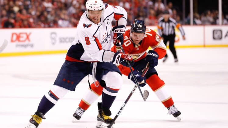 May 3, 2022; Sunrise, Florida, USA; Washington Capitals left wing Alex Ovechkin (8) moves the puck ahead of Florida Panthers right wing Patric Hornqvist (70) during the first period in game one of the first round of the 2022 Stanley Cup Playoffs at FLA Live Arena. Mandatory Credit: Sam Navarro-USA TODAY Sports