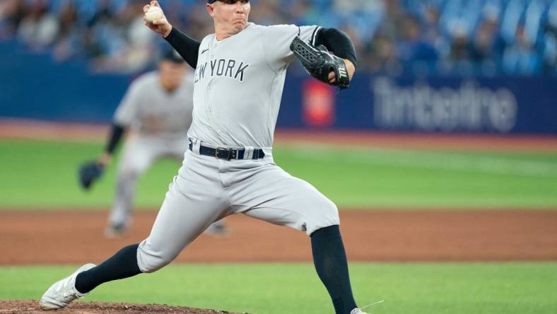 May 2, 2022; Toronto, Ontario, CAN; New York Yankees relief pitcher Chad Green (57) throws a pitch during the ninth inning against the Toronto Blue Jays at Rogers Centre. Mandatory Credit: Nick Turchiaro-USA TODAY Sports