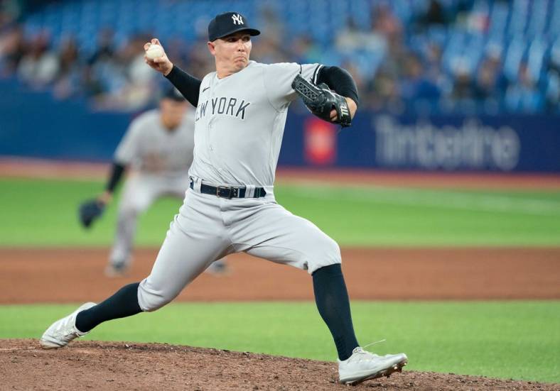 May 2, 2022; Toronto, Ontario, CAN; New York Yankees relief pitcher Chad Green (57) throws a pitch during the ninth inning against the Toronto Blue Jays at Rogers Centre. Mandatory Credit: Nick Turchiaro-USA TODAY Sports