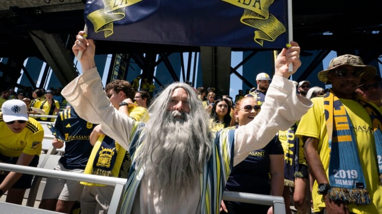 Nashville SC fan Stephen Mason dressed as Moses holds a sign above fans during first half at Geodis Park in Nashville, Tenn., Sunday, May 1, 2022. The game was Nashville SC   s first in the new stadium.Nas Nashvillesc Philadelphia Moses 001