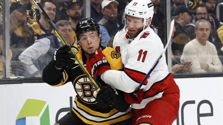 May 6, 2022; Boston, Massachusetts, USA; Carolina Hurricanes center Jordan Staal (11) collides with Boston Bruins defenseman Charlie McAvoy (73) during the first period in game three of the first round of the 2022 Stanley Cup Playoffs at TD Garden. Mandatory Credit: Winslow Townson-USA TODAY Sports