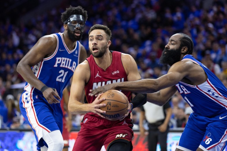 May 6, 2022; Philadelphia, Pennsylvania, USA; Philadelphia 76ers guard James Harden (1) knocks the ball from Miami Heat guard Max Strus (31) in front of center Joel Embiid (21) during the first quarter in game three of the second round for the 2022 NBA playoffs at Wells Fargo Center. Mandatory Credit: Bill Streicher-USA TODAY Sports