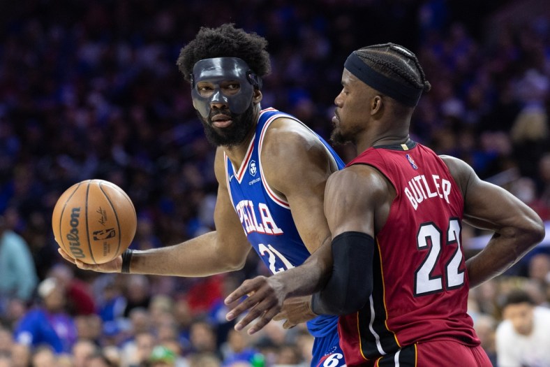 May 6, 2022; Philadelphia, Pennsylvania, USA; Philadelphia 76ers center Joel Embiid (21) controls the ball against Miami Heat forward Jimmy Butler (22) during the third quarter in game three of the second round for the 2022 NBA playoffs at Wells Fargo Center. Mandatory Credit: Bill Streicher-USA TODAY Sports