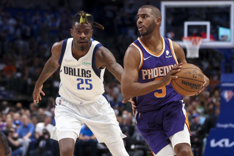 May 6, 2022; Dallas, Texas, USA; Phoenix Suns guard Chris Paul (3) controls the ball as Dallas Mavericks forward Reggie Bullock (25) defends during the first quarter in game three of the second round of the 2022 NBA playoffs at American Airlines Center. Mandatory Credit: Kevin Jairaj-USA TODAY Sports