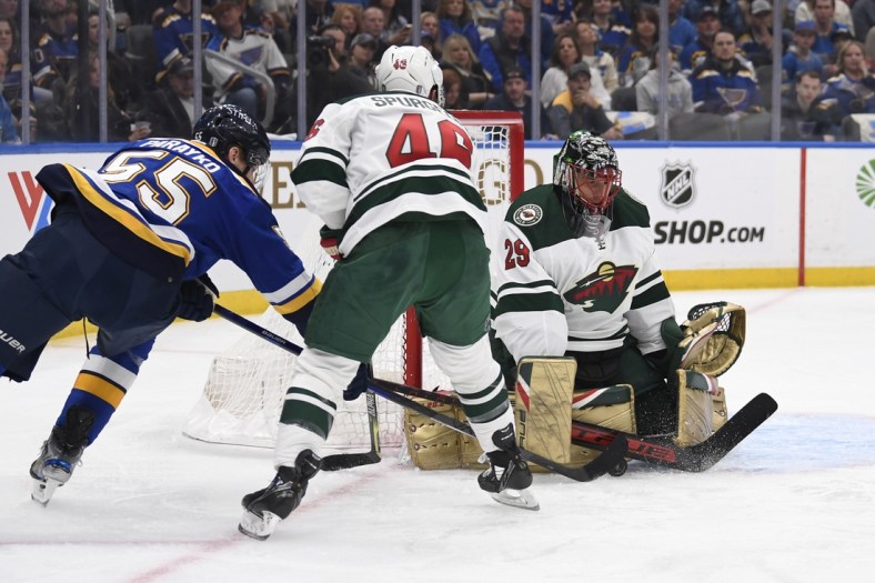 May 6, 2022; St. Louis, Missouri, USA; Minnesota Wild goaltender Marc-Andre Fleury (29) and defenseman Jared Spurgeon (46) defend the net from St. Louis Blues defenseman Colton Parayko (55) during the first period in game three of the first round of the 2022 Stanley Cup Playoffs at Enterprise Center. Mandatory Credit: Jeff Le-USA TODAY Sports