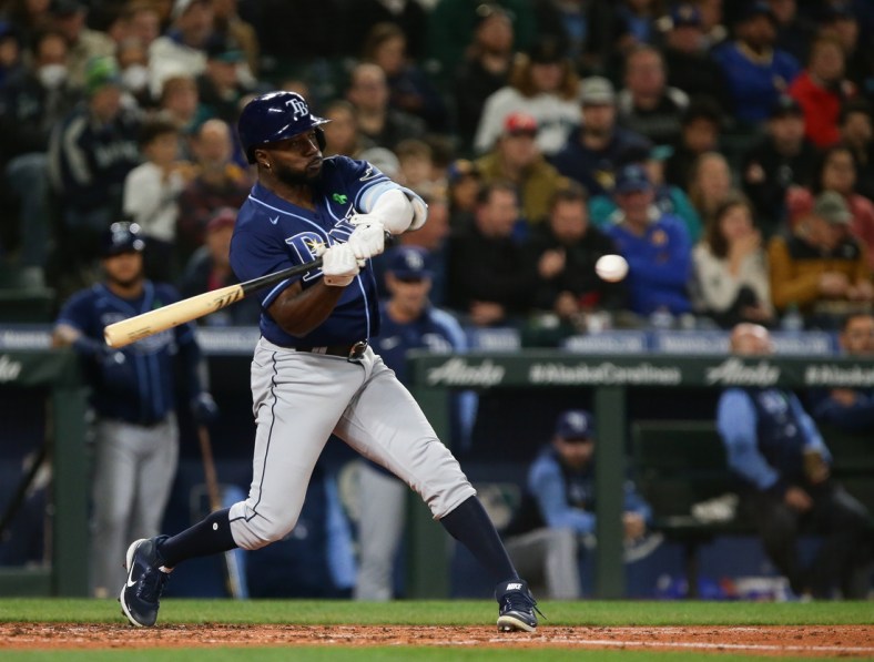 May 6, 2022; Seattle, Washington, USA;  Tampa Bay Rays designated hitter Randy Arozarena (56) hits an RBI single against the Seattle Mariners during the second inning at T-Mobile Park. Mandatory Credit: Lindsey Wasson-USA TODAY Sports