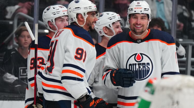 May 6, 2022; Los Angeles, California, USA; Edmonton Oilers center Ryan Nugent-Hopkins (93), left wing Evander Kane (91) and defenseman Cody Ceci (5) celebrate after a goal against the LA Kings in the third period of game three of the first round of the 2022 Stanley Cup Playoffs at Crypto.com Arena. Mandatory Credit: Kirby Lee-USA TODAY Sports