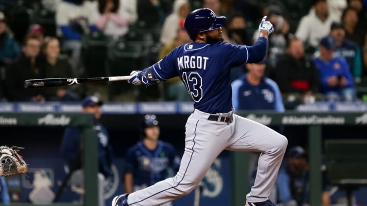 May 6, 2022; Seattle, Washington, USA;  Tampa Bay Rays right fielder Manuel Margot (13) follows through on a three-run home run during the ninth inning against the Seattle Mariners at T-Mobile Park. Mandatory Credit: Lindsey Wasson-USA TODAY Sports