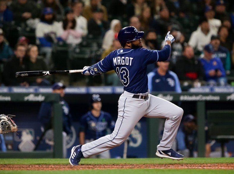 May 6, 2022; Seattle, Washington, USA;  Tampa Bay Rays right fielder Manuel Margot (13) follows through on a three-run home run during the ninth inning against the Seattle Mariners at T-Mobile Park. Mandatory Credit: Lindsey Wasson-USA TODAY Sports