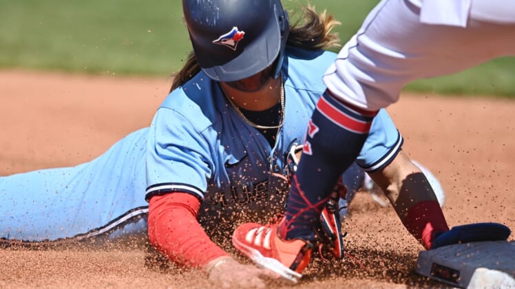 May 7, 2022; Cleveland, Ohio, USA; Toronto Blue Jays shortstop Bo Bichette (11) is caught stealing third during the fourth inning against the Cleveland Guardians at Progressive Field. Mandatory Credit: Ken Blaze-USA TODAY Sports