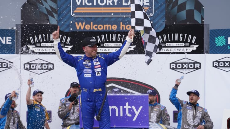 May 7, 2022; Darlington, South Carolina, USA; NASCAR Xfinity Series driver Justin Allgaier (7) celebrates after winning the Mahindra ROXOR 200 at Darlington Raceway. Mandatory Credit: Jasen Vinlove-USA TODAY Sports