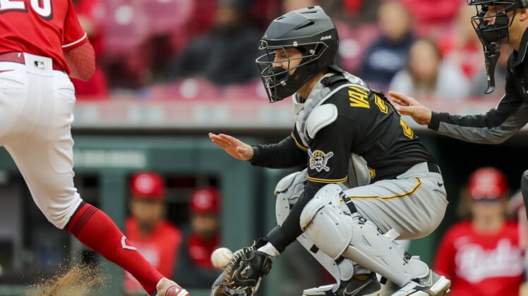 May 7, 2022; Cincinnati, Ohio, USA; Pittsburgh Pirates catcher Josh VanMeter (26) plays the field against Cincinnati Reds designated hitter Tommy Pham (28) in the eighth inning at Great American Ball Park. Mandatory Credit: Katie Stratman-USA TODAY Sports