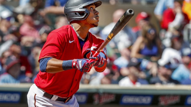 May 7, 2022; Minneapolis, Minnesota, USA; Minnesota Twins second baseman Jorge Polanco (11) hits a solo home run against the Oakland Athletics in the sixth inning at Target Field. Mandatory Credit: Bruce Kluckhohn-USA TODAY Sports