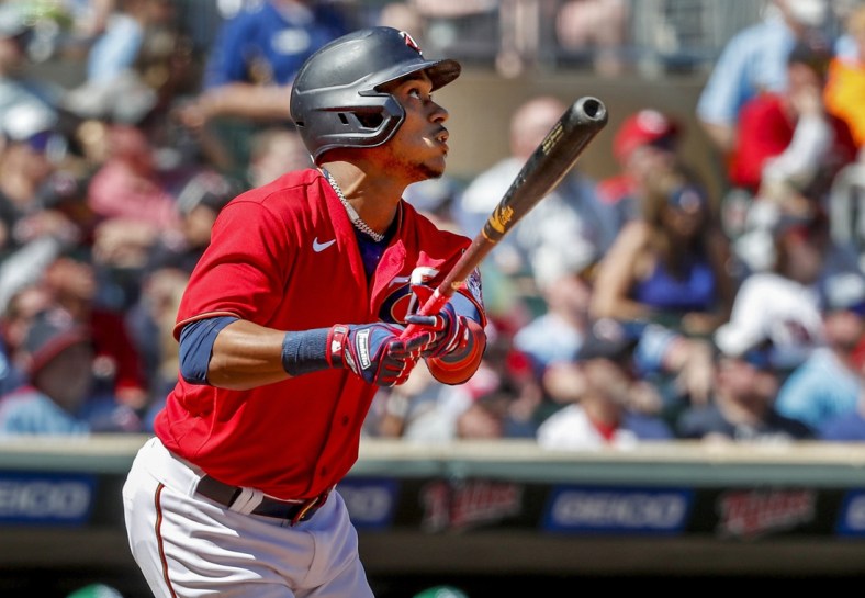 May 7, 2022; Minneapolis, Minnesota, USA; Minnesota Twins second baseman Jorge Polanco (11) hits a solo home run against the Oakland Athletics in the sixth inning at Target Field. Mandatory Credit: Bruce Kluckhohn-USA TODAY Sports