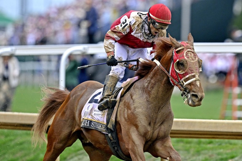 May 7, 2022; Louisville, KY, USA; Sonny Leon aboard Rich Strike celebrates winning the 148th running of the Kentucky Derby at Churchill Downs. Mandatory Credit: Jamie Rhodes-USA TODAY Sports