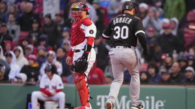 May 7, 2022; Boston, Massachusetts, USA;  Chicago White Sox third baseman Jake Burger (30) scores a run on a sacrifice fly ball hit by second baseman Leury Garcia (not pictured) against the Boston Red Sox during the ninth inning at Fenway Park. Mandatory Credit: Gregory Fisher-USA TODAY Sports