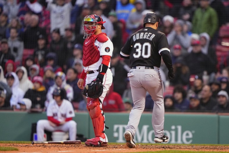 May 7, 2022; Boston, Massachusetts, USA;  Chicago White Sox third baseman Jake Burger (30) scores a run on a sacrifice fly ball hit by second baseman Leury Garcia (not pictured) against the Boston Red Sox during the ninth inning at Fenway Park. Mandatory Credit: Gregory Fisher-USA TODAY Sports