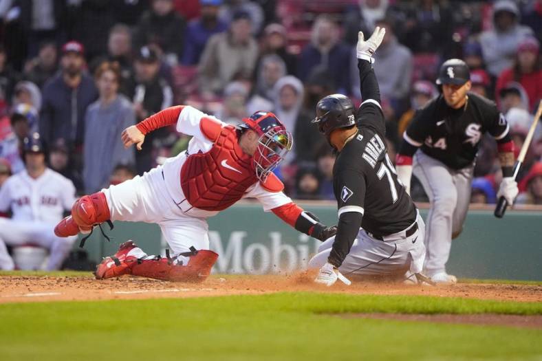 May 7, 2022; Boston, Massachusetts, USA; Chicago White Sox first baseman Jose Abreu (79) scores on RBI single by center fielder Luis Robert (not pictured) against the Boston Red Sox during the tenth inning at Fenway Park. Mandatory Credit: Gregory Fisher-USA TODAY Sports