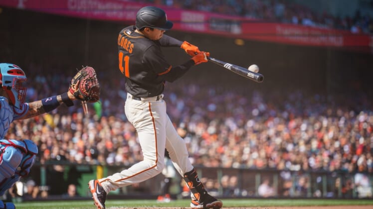 May 7, 2022; San Francisco, California, USA;  San Francisco Giants third baseman Wilmer Flores (41) hits a grand slam home run during the first inning against the St. Louis Cardinals at Oracle Park. Mandatory Credit: Neville E. Guard-USA TODAY Sports