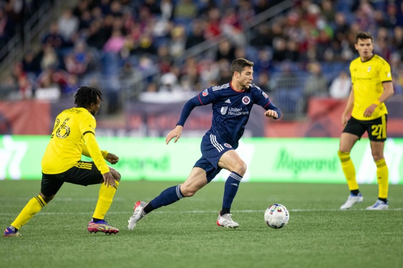 May 7, 2022; Foxborough, Massachusetts, USA; New England Revolution midfielder Matt Polster (8) possesses the ball during the first half against the Columbus Crew at Gillette Stadium. Mandatory Credit: Paul Rutherford-USA TODAY Sports