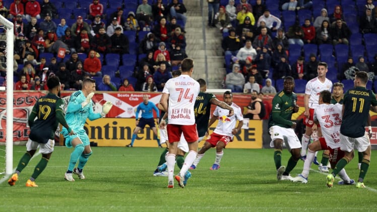May 7, 2022; Harrison, New Jersey, USA;  New York Red Bulls midfielder Aaron Long (33) scores a goal during the second half against the Portland Timbers at Red Bull Arena. Mandatory Credit: Vincent Carchietta-USA TODAY Sports